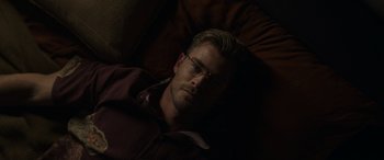 Movie still from “Spiderhead” (2022), directed by Joseph Kosinski – A person laying on a bed; Close Up shot, High angle