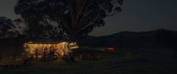 Movie still from “Spiderhead” (2022), directed by Joseph Kosinski – A truck parked in the middle of a field at night; Extreme Wide shot, Low angle