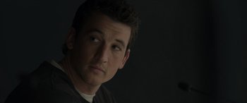 Movie still from “Spiderhead” (2022), directed by Joseph Kosinski – A person wearing a shirt; Close Up shot, Over the shoulder angle