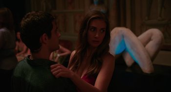 Movie still from “Spin Me Round” (2022), directed by Jeff Baena – A man and a woman are dancing together in a room; Medium shot, Over the shoulder angle