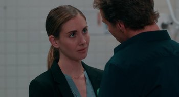 Movie still from “Spin Me Round” (2022), directed by Jeff Baena – A man and a woman talking to each other; Close Up shot, Over the shoulder angle