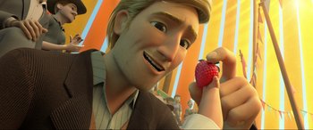 Movie still from “Spirit Untamed” (2021), directed by Ennio Torresan – A man holding a strawberry in front of a crowd of onlookers; Close Up shot, Over the shoulder angle