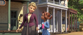 Movie still from “Spirit Untamed” (2021), directed by Ennio Torresan – Two animated women holding hands in front of a building; Medium shot, Over the shoulder angle