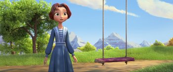 Movie still from “Spirit Untamed” (2021), directed by Ennio Torresan – A woman standing next to a swing in a field; Wide shot, High angle