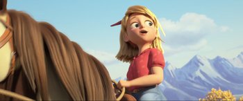 Movie still from “Spirit Untamed” (2021), directed by Ennio Torresan – A girl riding on the back of a brown horse; Close Up shot, Low angle