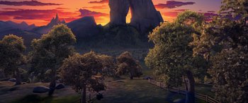 Movie still from “Spirit Untamed” (2021), directed by Ennio Torresan – An image of an outdoor scene with trees and mountains; Extreme Wide shot, High angle