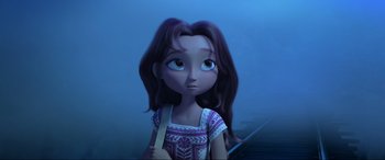 Movie still from “Spirit Untamed” (2021), directed by Ennio Torresan – A girl with long brown hair is looking at the camera; Close Up shot, Low angle