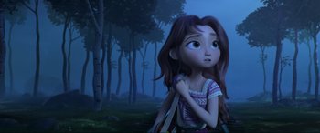 Movie still from “Spirit Untamed” (2021), directed by Ennio Torresan – A young girl holding a stick in the woods; Medium shot, Over the shoulder angle