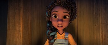 Movie still from “Spirit Untamed” (2021), directed by Ennio Torresan – A girl with a long braid is looking at the camera; Close Up shot, Over the shoulder angle