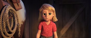 Movie still from “Spirit Untamed” (2021), directed by Ennio Torresan – A girl with blonde hair wearing a red shirt; Medium shot, Over the shoulder angle