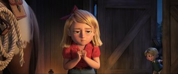 Movie still from “Spirit Untamed” (2021), directed by Ennio Torresan – A girl with her hands in her mouth; Medium shot, High angle