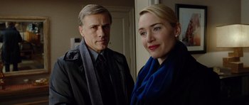 Movie still from “Carnage” (2011), directed by Roman Polanski – A man and a woman standing next to each other; Close Up shot, Low angle