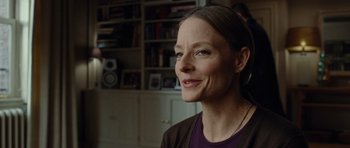 Movie still from “Carnage” (2011), directed by Roman Polanski – A person wearing a purple shirt; Close Up shot, Over the shoulder angle