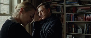 Movie still from “Carnage” (2011), directed by Roman Polanski – A man and a woman are looking at each other; Close Up shot, Over the shoulder angle