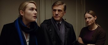 Movie still from “Carnage” (2011), directed by Roman Polanski – A man and a woman standing next to each other; Close Up shot, Low angle