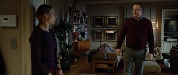 Movie still from “Carnage” (2011), directed by Roman Polanski – A man and a woman in a living room; Wide shot, Low angle