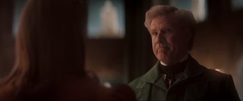 Movie still from “Spirited” (2022), directed by Sean Anders – An older man in a green jacket looking at the camera; Close Up shot, Over the shoulder angle