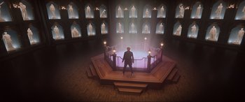 Movie still from “Spirited” (2022), directed by Sean Anders – A man standing on a platform in a room; Extreme Wide shot, High angle