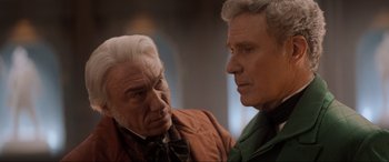 Movie still from “Spirited” (2022), directed by Sean Anders – Two older men standing next to each other in a room; Close Up shot, Over the shoulder angle
