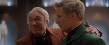 Movie still from “Spirited” (2022), directed by Sean Anders – Two older men sitting next to each other in a room; Close Up shot, Over the shoulder angle