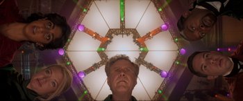 Movie still from “Spirited” (2022), directed by Sean Anders – A man standing in front of a ceiling with lights; Close Up shot, Low angle