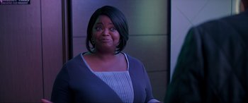 Movie still from “Spirited” (2022), directed by Sean Anders – A person wearing a dress; Medium shot, Over the shoulder angle