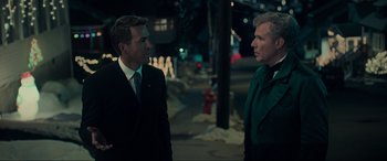 Movie still from “Spirited” (2022), directed by Sean Anders – Two men standing on the side of the road at night; Medium shot, Over the shoulder angle