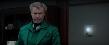 Movie still from “Spirited” (2022), directed by Sean Anders – A person wearing a suit and tie; Close Up shot, Over the shoulder angle