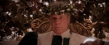 Movie still from “Spirited” (2022), directed by Sean Anders – A man wearing a wreath of leaves on his head; Close Up shot, Overhead angle
