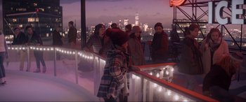 Movie still from “Spirited” (2022), directed by Sean Anders – A group of people standing on top of a building; Extreme Wide shot, Over the shoulder angle