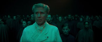 Movie still from “Spirited” (2022), directed by Sean Anders – A group of people standing in a dark room; Close Up shot, Low angle