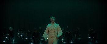 Movie still from “Spirited” (2022), directed by Sean Anders – A group of people standing in a room; Wide shot, High angle