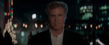 Movie still from “Spirited” (2022), directed by Sean Anders – A person wearing a suit and tie; Close Up shot, Over the shoulder angle