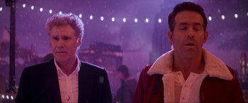 Movie still from “Spirited” (2022), directed by Sean Anders – Two people standing next to each other at night; Close Up shot, Low angle