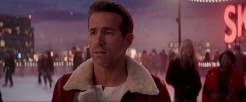 Movie still from “Spirited” (2022), directed by Sean Anders – A person wearing a jacket; Close Up shot, Over the shoulder angle