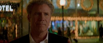 Movie still from “Spirited” (2022), directed by Sean Anders – A person wearing a suit and tie; Close Up shot, Over the shoulder angle