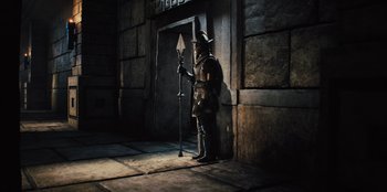 Movie still from “Spy Kids: Armageddon” (2023), directed by Robert Rodriguez – A man standing in front of a building; Wide shot, High angle