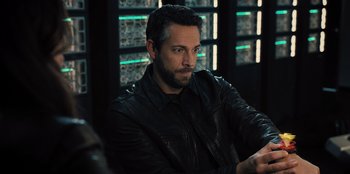 Movie still from “Spy Kids: Armageddon” (2023), directed by Robert Rodriguez – A person wearing a leather jacket; Close Up shot, Over the shoulder angle