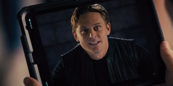 Movie still from “Spy Kids: Armageddon” (2023), directed by Robert Rodriguez – A person wearing a black jacket; Close Up shot, Over the shoulder angle