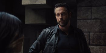 Movie still from “Spy Kids: Armageddon” (2023), directed by Robert Rodriguez – A person wearing a leather jacket; Close Up shot, Over the shoulder angle