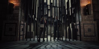 Movie still from “Spy Kids: Armageddon” (2023), directed by Robert Rodriguez – A man and a woman standing next to each other; Wide shot, Low angle