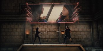 Movie still from “Spy Kids: Armageddon” (2023), directed by Robert Rodriguez – A couple of people that are holding baseball bats; Wide shot, Over the shoulder angle