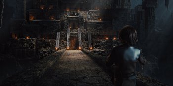 Movie still from “Spy Kids: Armageddon” (2023), directed by Robert Rodriguez – An image of a man standing in front of an ancient building; Wide shot, High angle