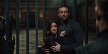 Movie still from “Spy Kids: Armageddon” (2023), directed by Robert Rodriguez – A man and a woman standing next to each other; Medium shot, Over the shoulder angle