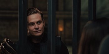 Movie still from “Spy Kids: Armageddon” (2023), directed by Robert Rodriguez – A person wearing a black vest; Close Up shot, Over the shoulder angle