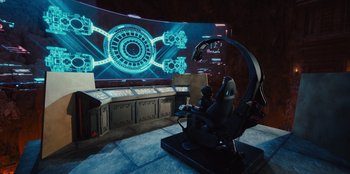 Movie still from “Spy Kids: Armageddon” (2023), directed by Robert Rodriguez – An image of a video game in a dark room; Extreme Wide shot, High angle