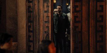 Movie still from “Spy Kids: Armageddon” (2023), directed by Robert Rodriguez – A group of men standing in front of a mirror; Medium shot, Over the shoulder angle