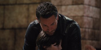 Movie still from “Spy Kids: Armageddon” (2023), directed by Robert Rodriguez – A person and a child; Close Up shot, Over the shoulder angle