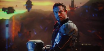 Movie still from “Spy Kids: Armageddon” (2023), directed by Robert Rodriguez – A person holding a hammer in a room; Medium shot, Over the shoulder angle