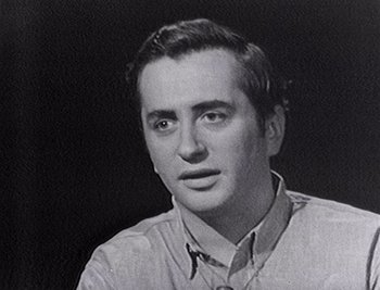 Movie still from “Sr.” (2022), directed by Chris Smith – A black - and - white photo of a man in a dress shirt; Close Up shot, Low angle
